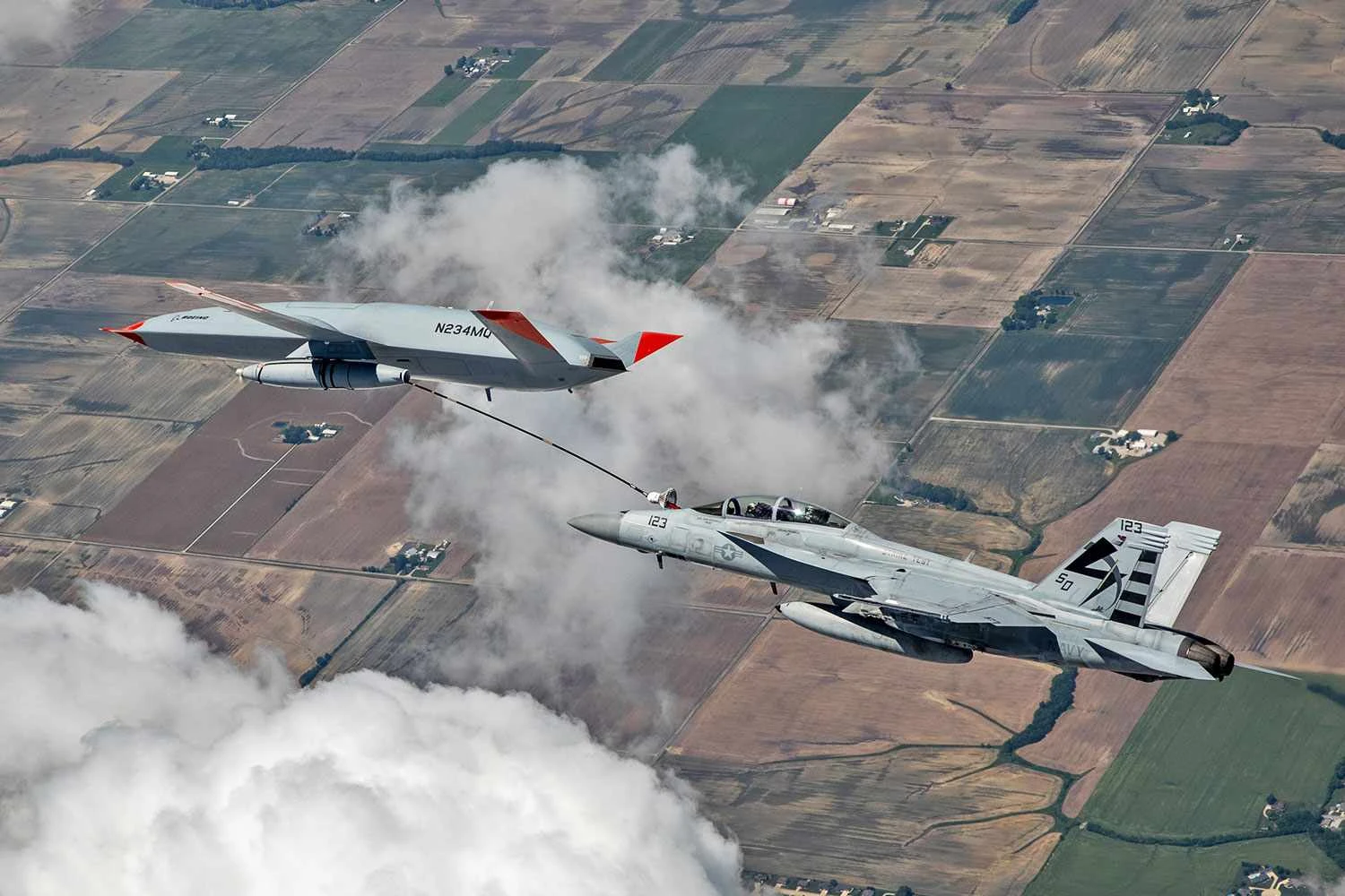 The MQ-25 drone refueling a F/A-18 fighter (Boeing)