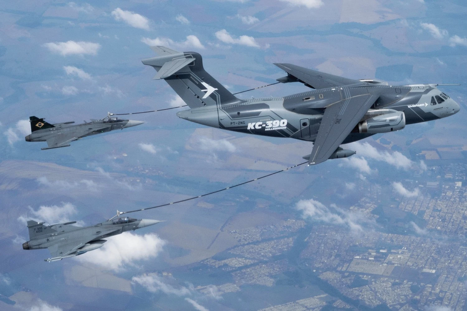 The KC-390 refuels a Gripen fighter in flight