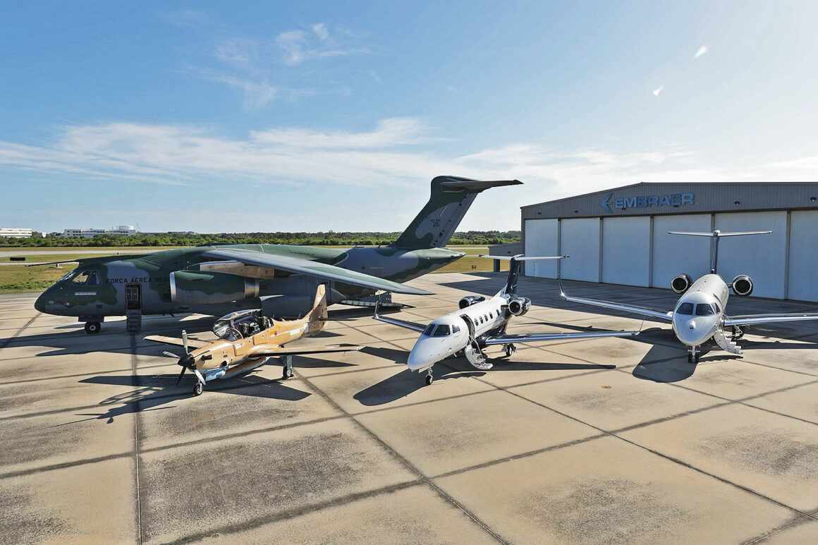 The C-390 Millennium alongside the A-29 and the Phenom 300E and Praetor 600 business jets in Melbourne, Florida