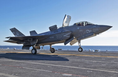 A U.S. Marine Corps F-35B fighter jet lands on the Japanese aircraft carrier JS Kaga