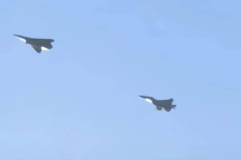 Prototype of Shenyang's 6th generation fighter chased by a J-16