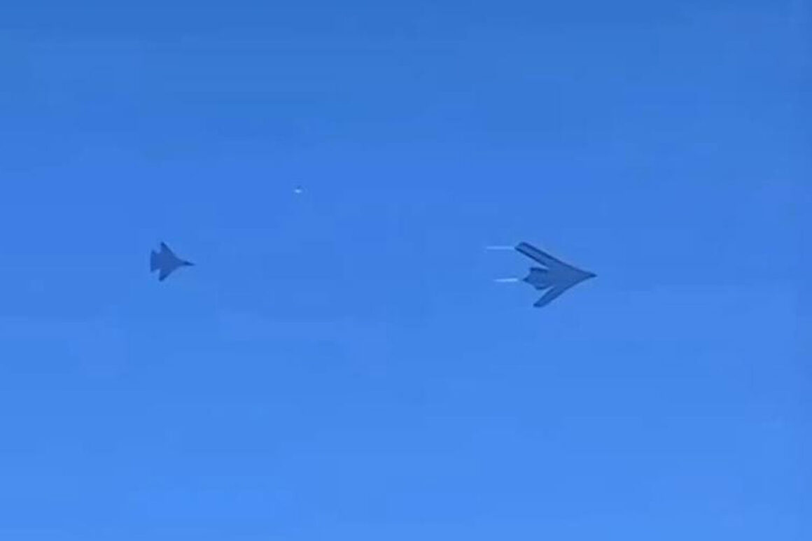 The alleged H-20 stealth bomber flying alongside a J-16 fighter